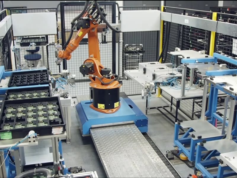 Industrial robotic arm operating on a production line